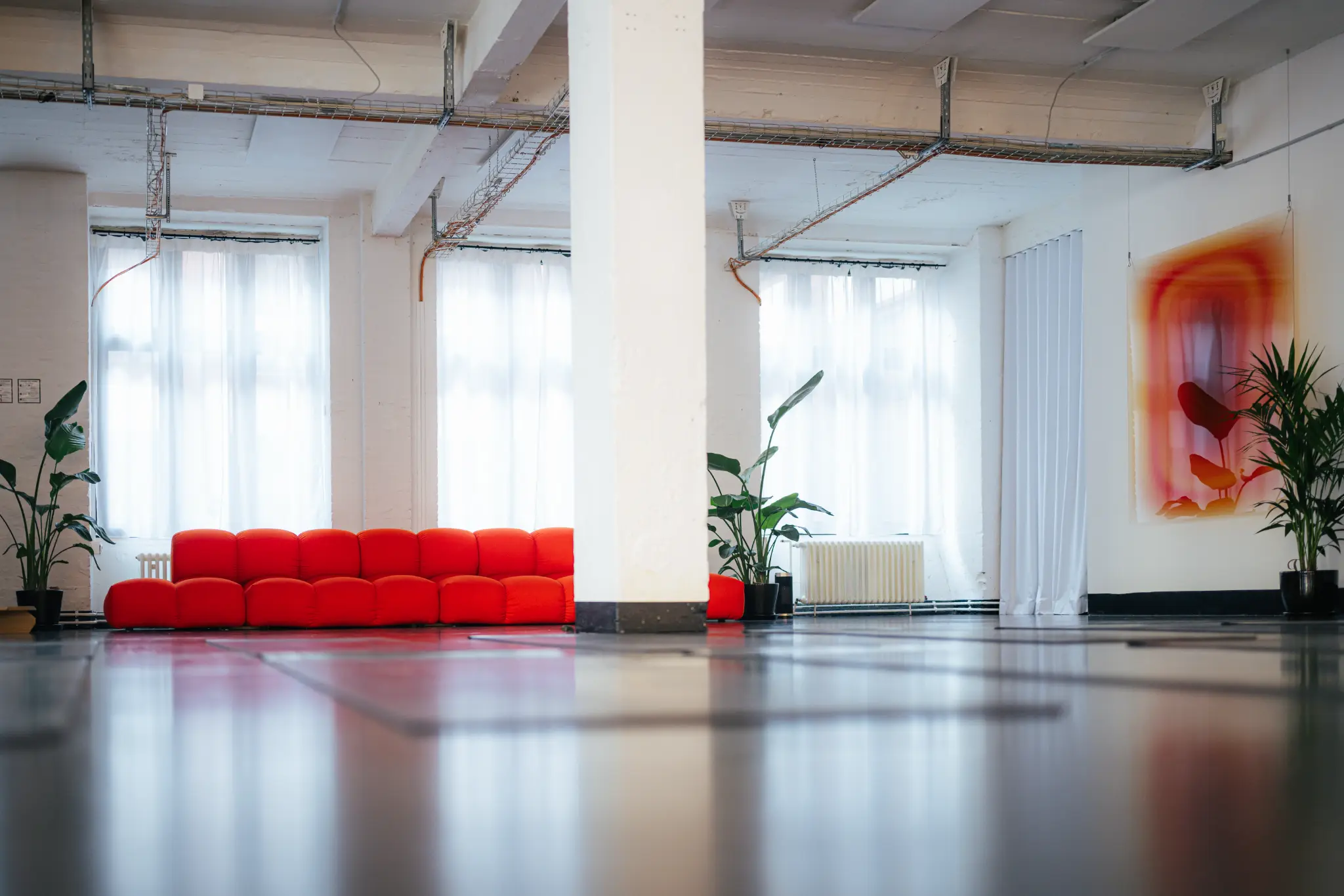 The red FLOAT couch
